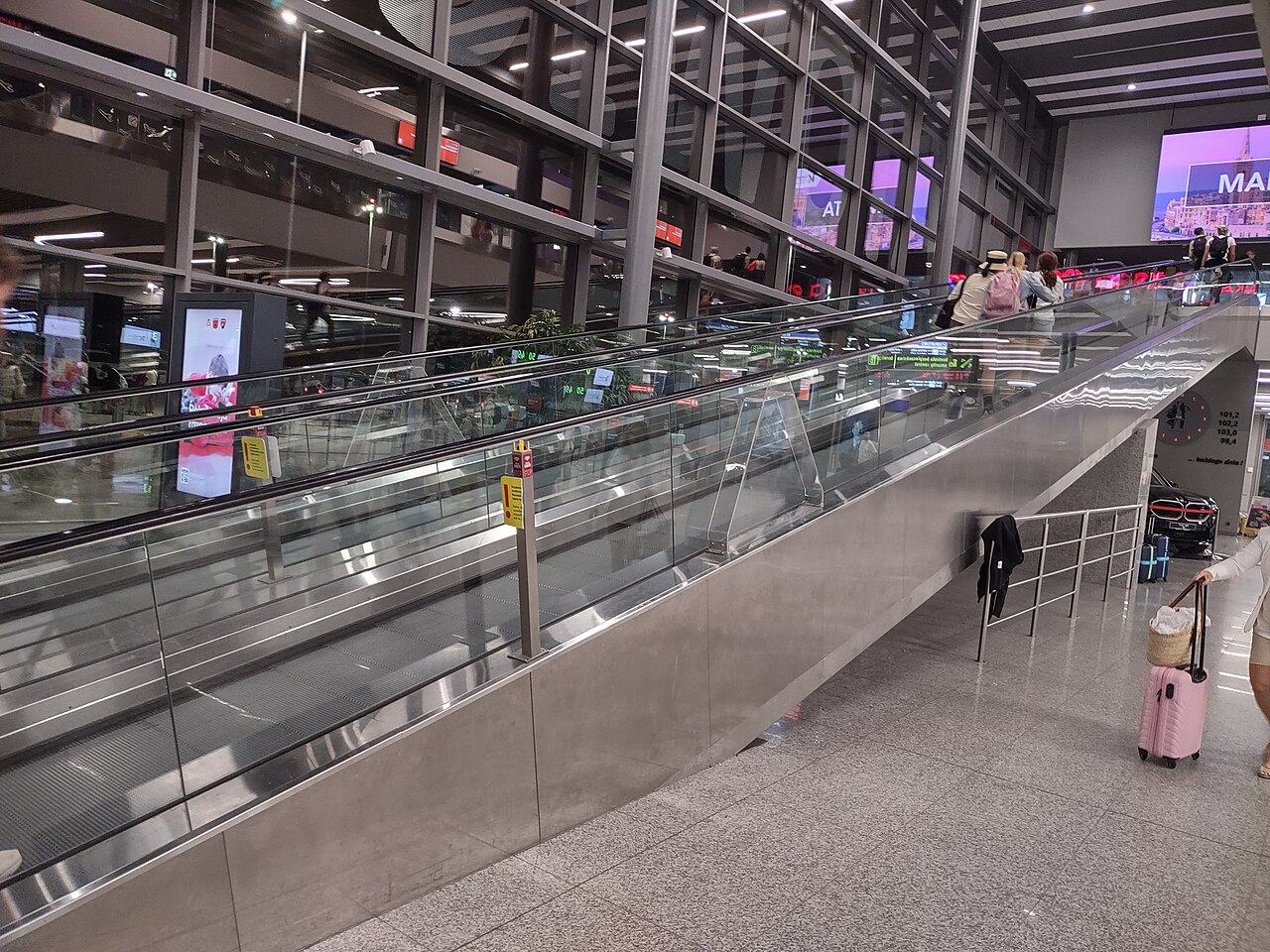 Glazed interior and moving walkway in Terminal B, Katowice Airport, 2024