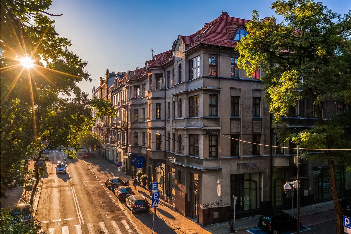 The front of the Hornigold townhouse at 6 Kopernika Street in Katowice, with flags by the street entrance.