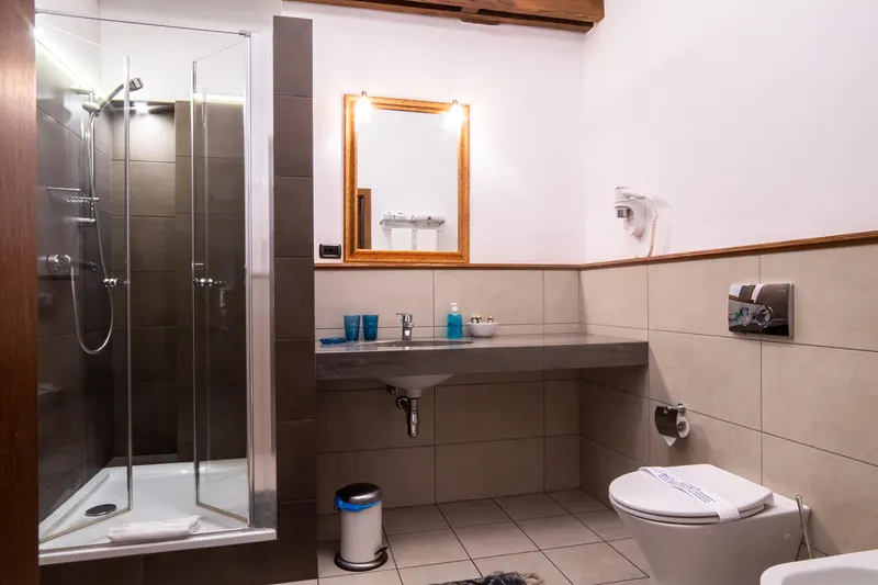 Bathroom with a shower cubicle and washbasin — Deluxe Apartment, Hornigold