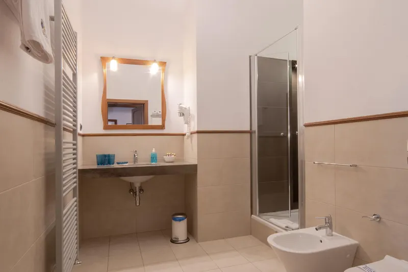 Bathroom with a shower cubicle and washbasin — Prestige Deluxe Apartment, Hornigold