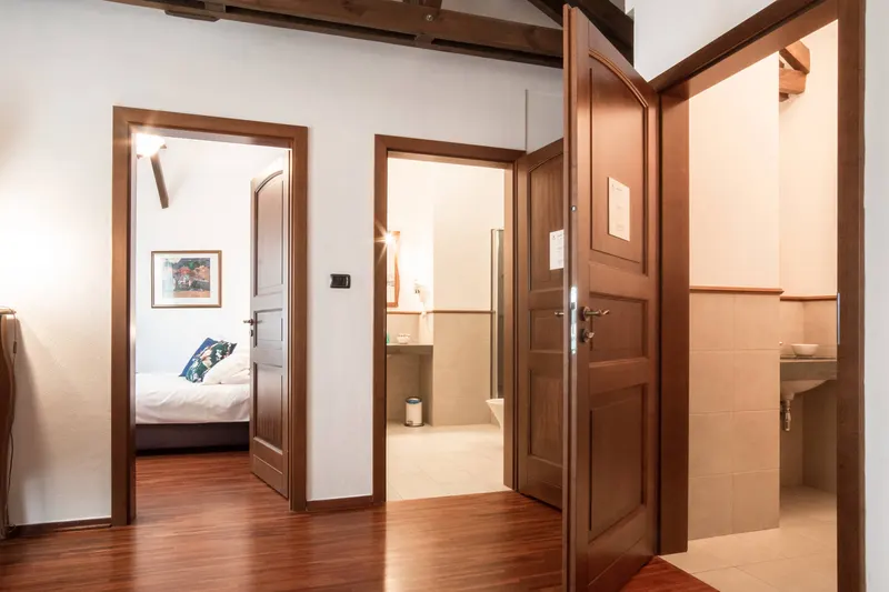 Corridor with doorways to a bedroom and bathroom — Prestige Deluxe Apartment, Hornigold
